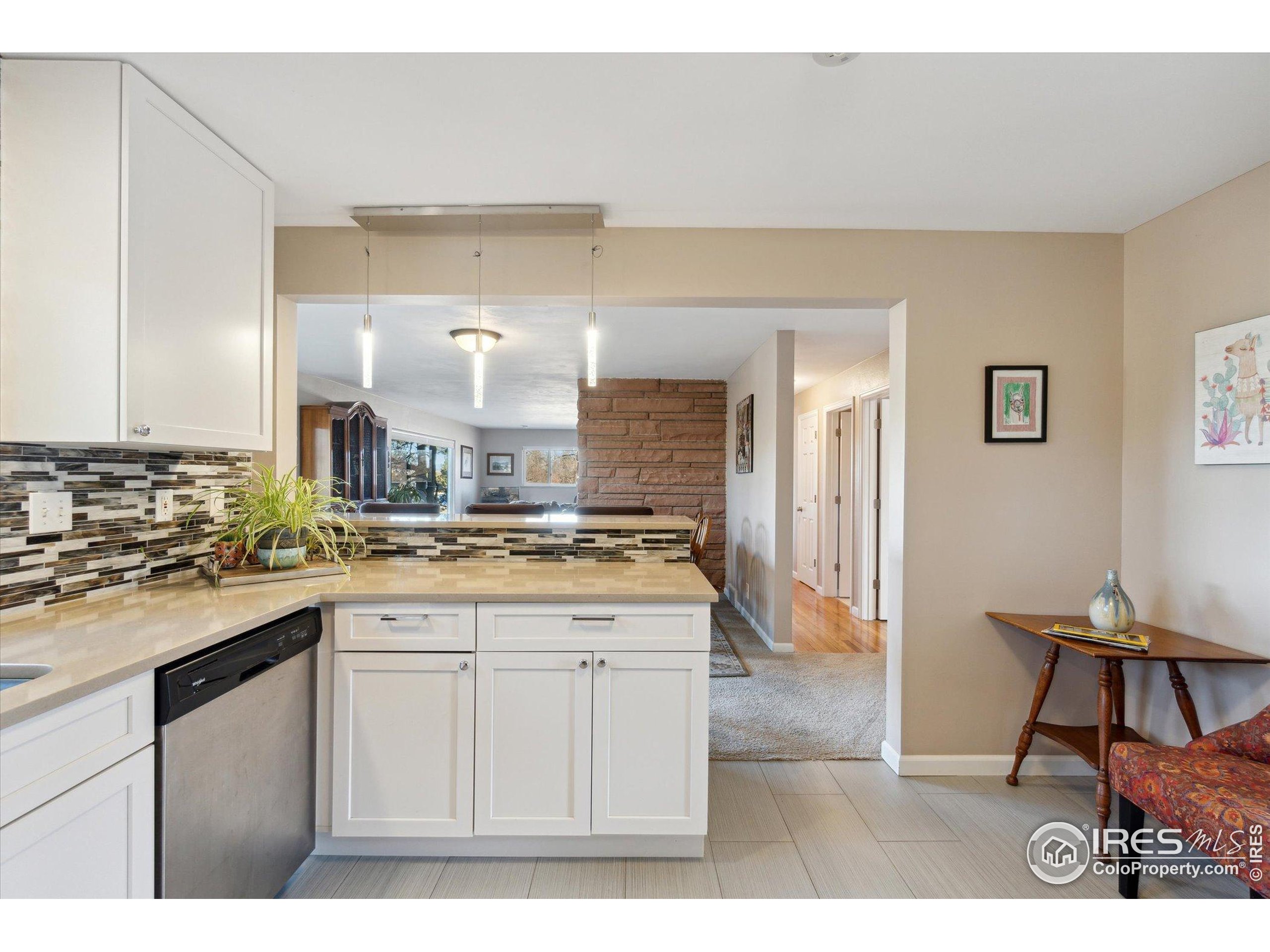 1034 Spring Drive Boulder, CO 80303 - Photo 14 of 49 a kitchen with a sink cabinets and wooden floor