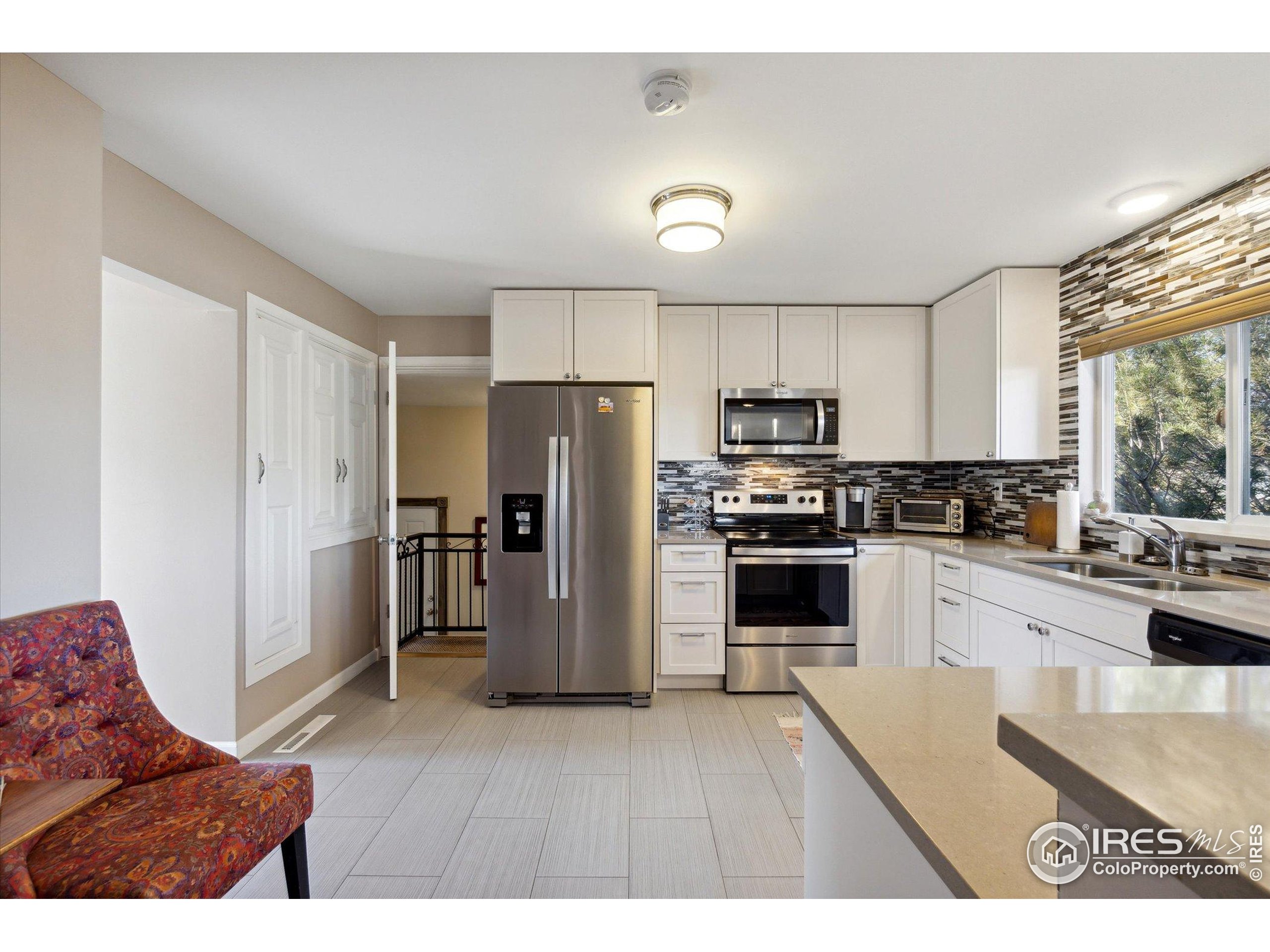 1034 Spring Drive Boulder, CO 80303 - Photo 15 of 49 a kitchen with refrigerator cabinets and furniture