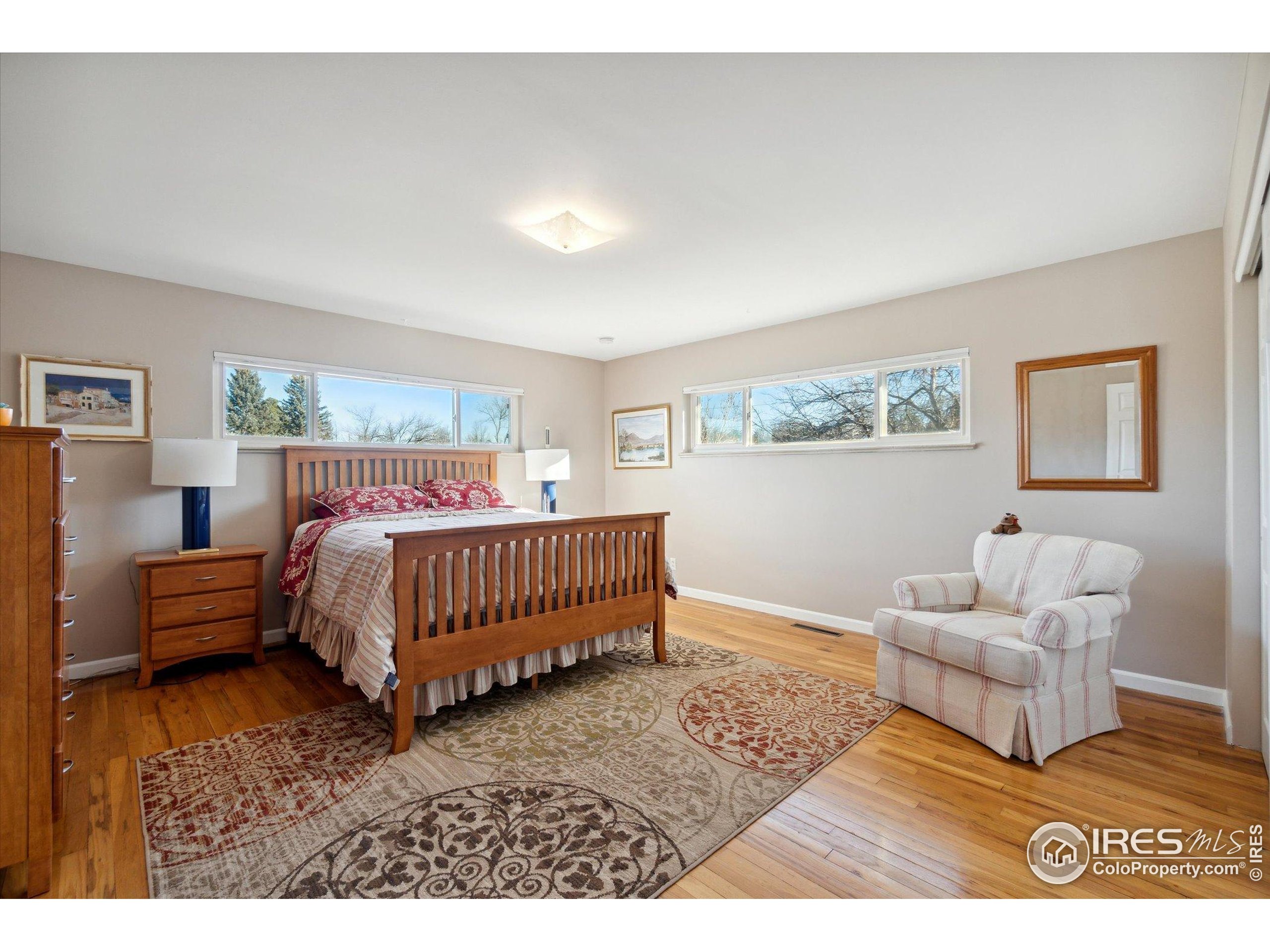 1034 Spring Drive Boulder, CO 80303 - Photo 17 of 49 a bedroom with a bed and a couch