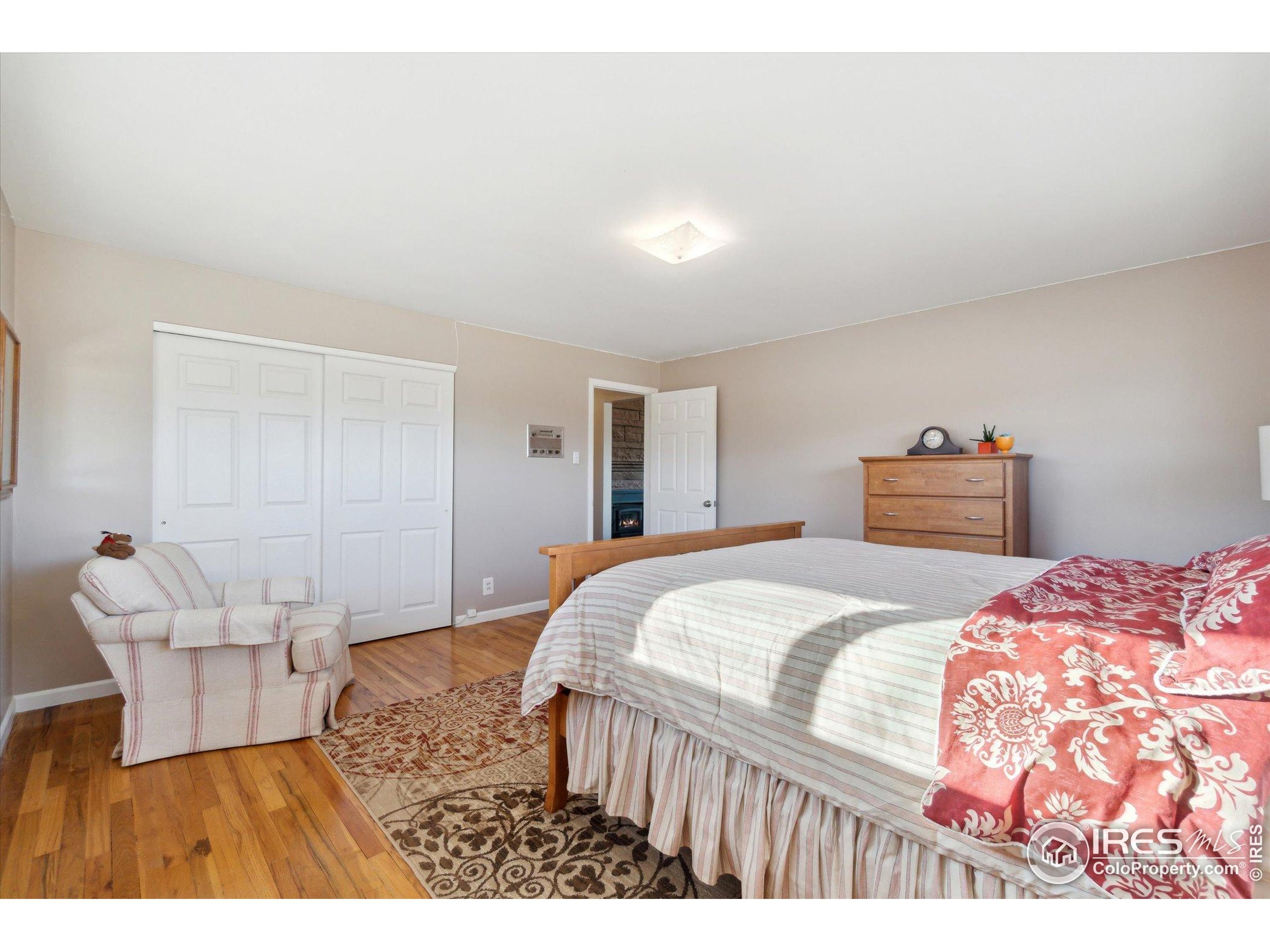 1034 Spring Drive Boulder, CO 80303 - Photo 18 of 49 a bedroom with a bed and a couch