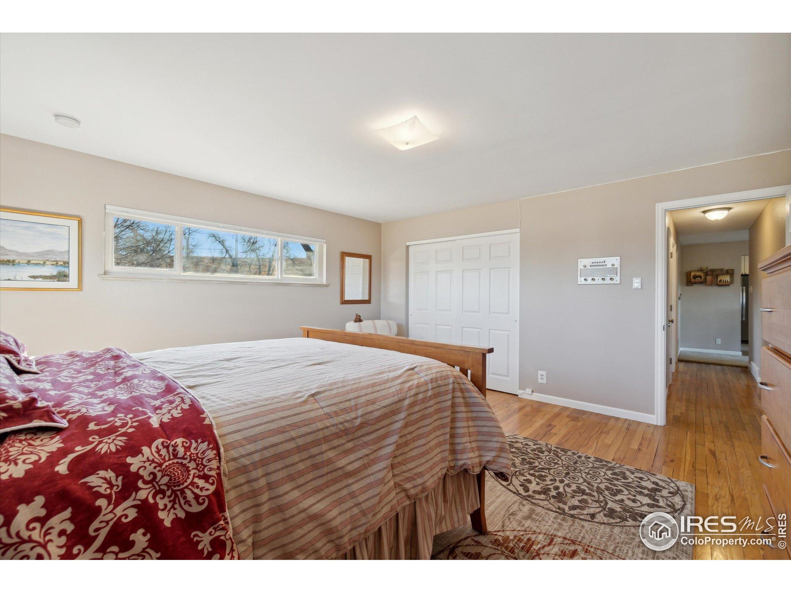 1034 Spring Drive Boulder, CO 80303 - Photo 19 of 49 a bedroom with a bed and a dresser