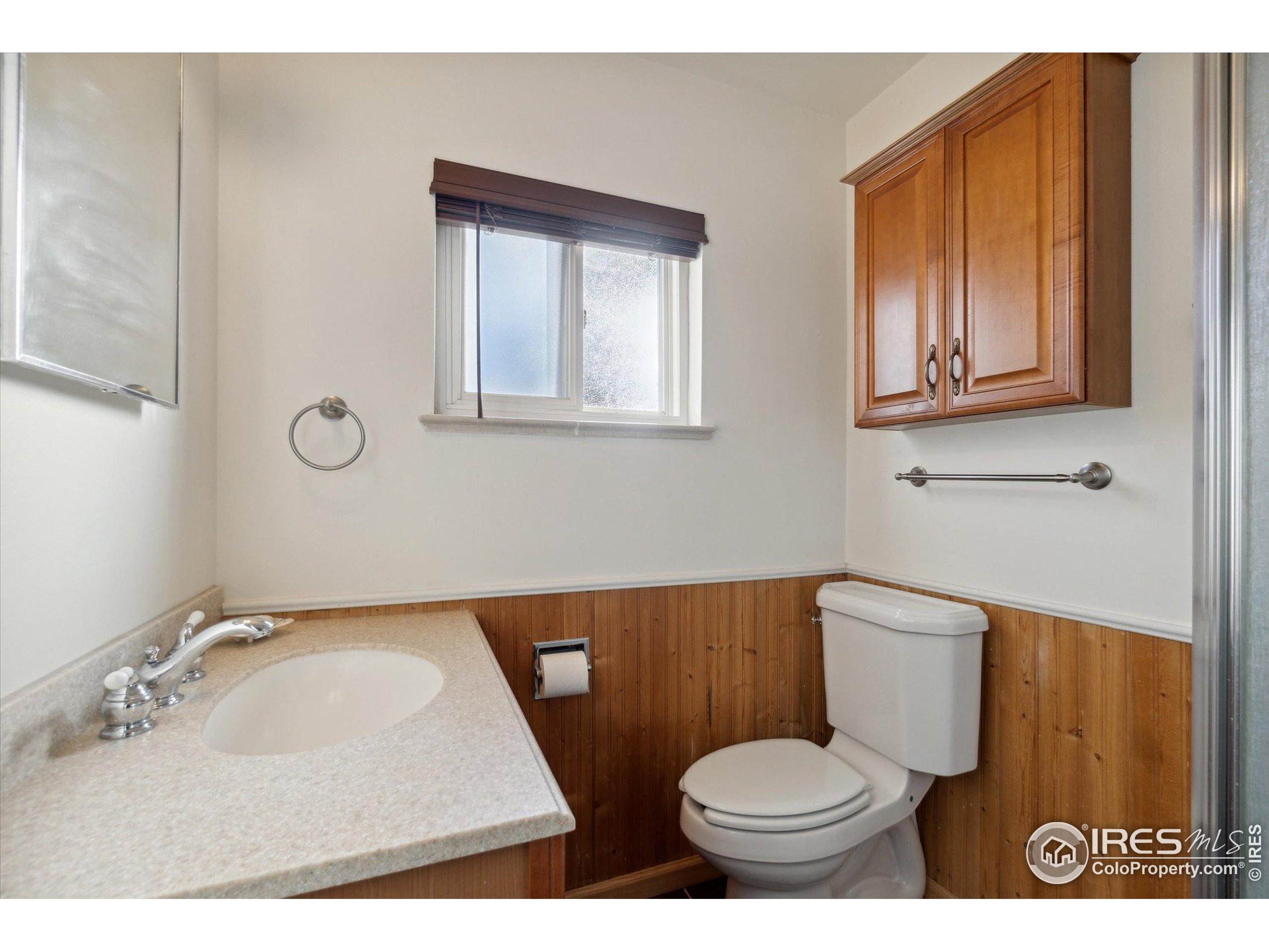 1034 Spring Drive Boulder, CO 80303 - Photo 21 of 49 a bathroom with a toilet sink and mirror
