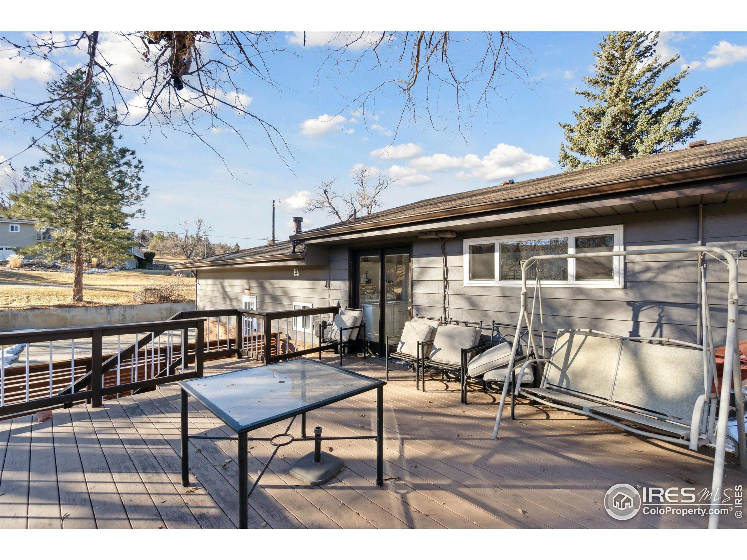 1034 Spring Drive Boulder, CO 80303 - Photo 24 of 49 a roof deck with table and chairs