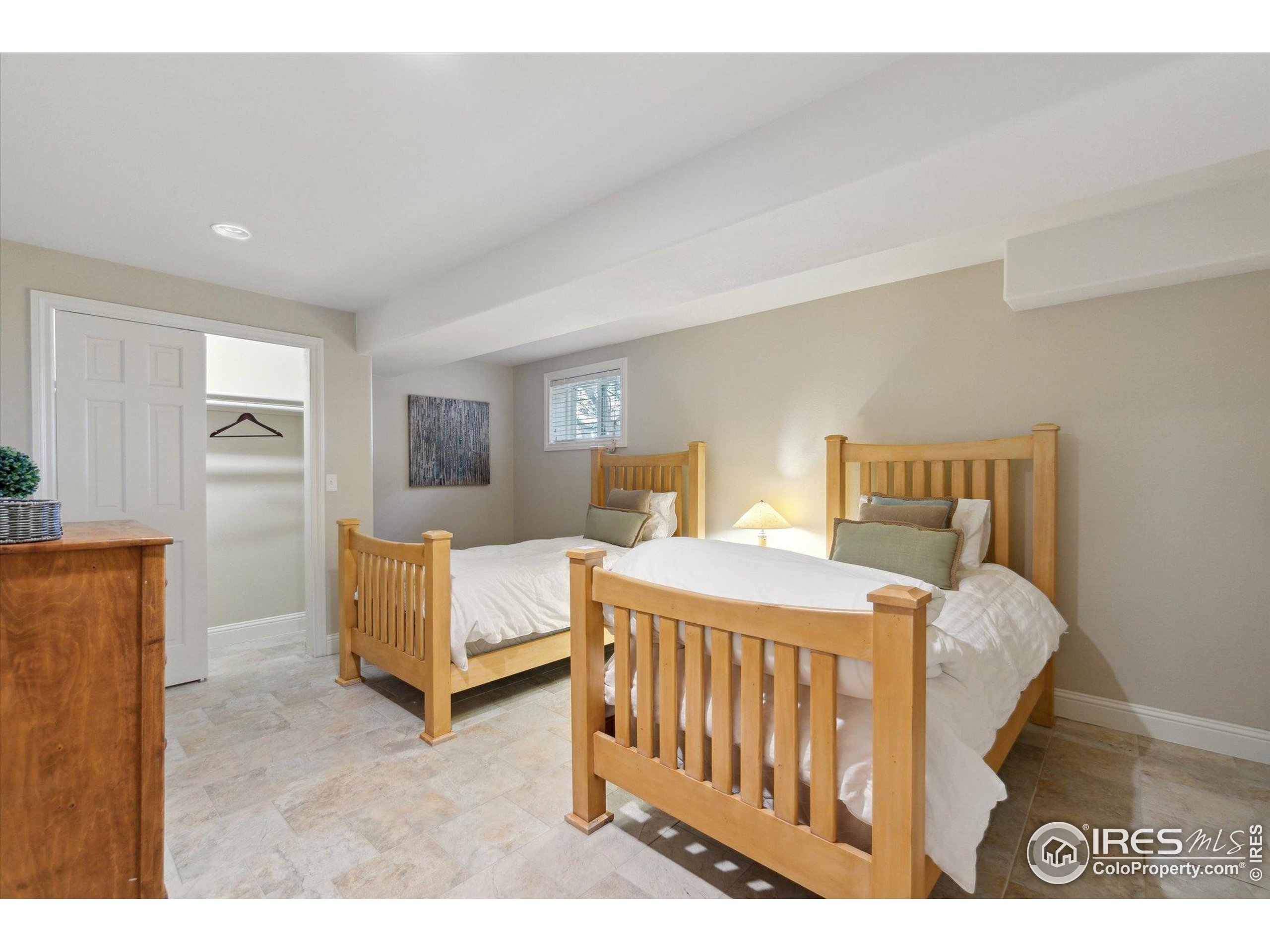 1034 Spring Drive Boulder, CO 80303 - Photo 32 of 49 a bedroom with a bed and a view of bedroom