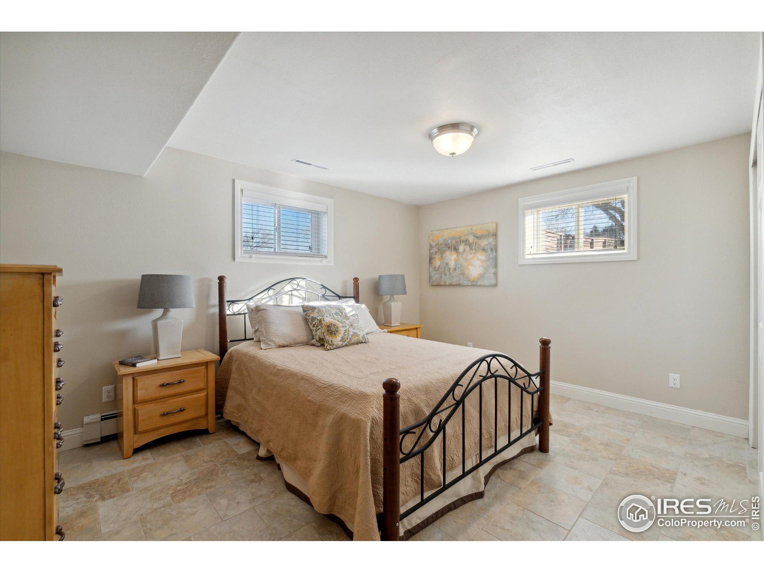 1034 Spring Drive Boulder, CO 80303 - Photo 37 of 49 a bedroom with a bed and a night stand