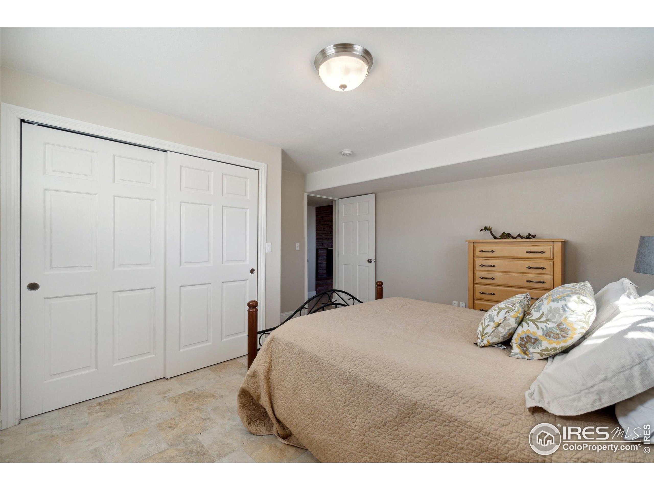 1034 Spring Drive Boulder, CO 80303 - Photo 38 of 49 a bedroom with a bed and a window
