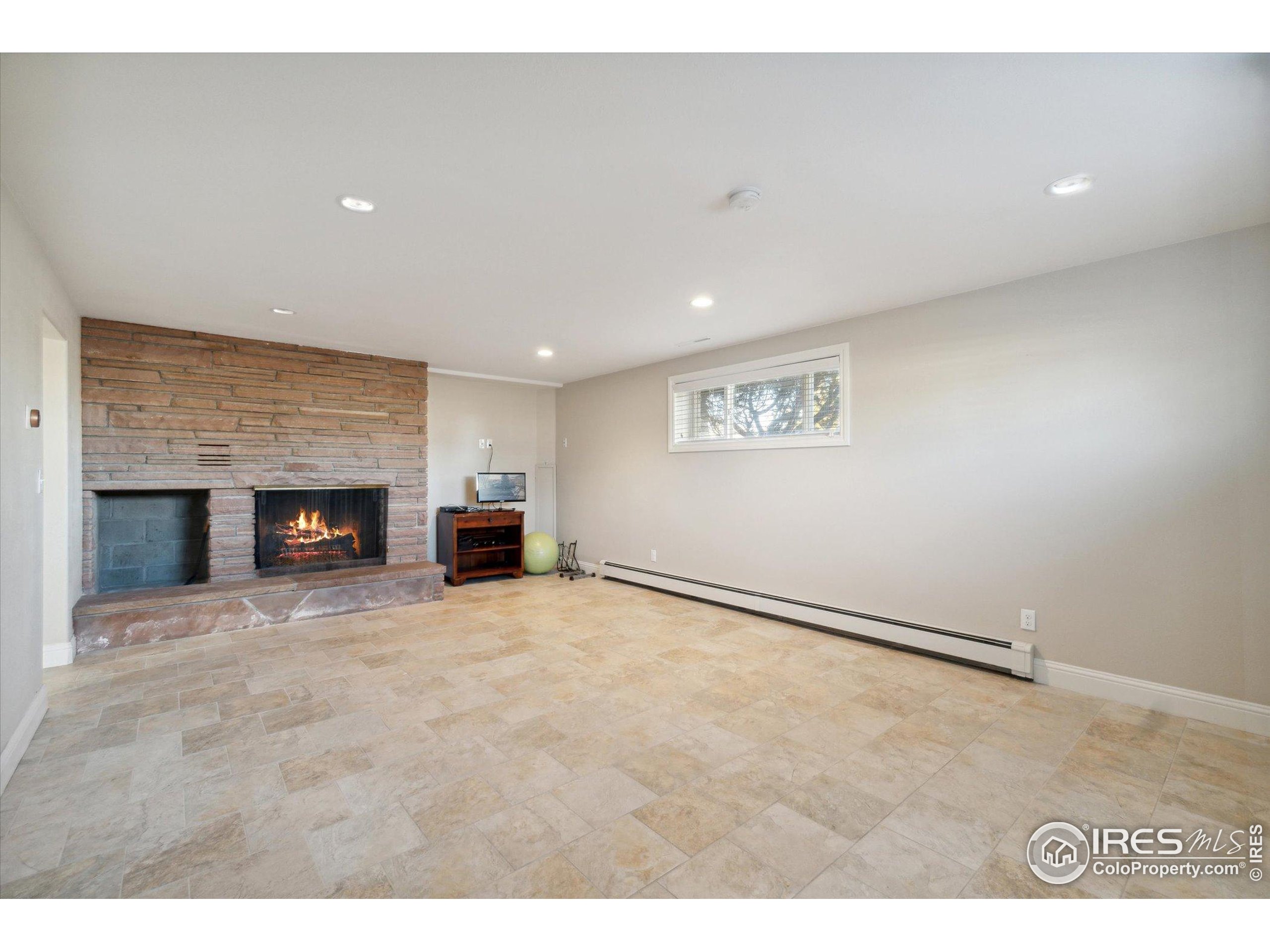 1034 Spring Drive Boulder, CO 80303 - Photo 39 of 49 a view of an empty room with a fireplace