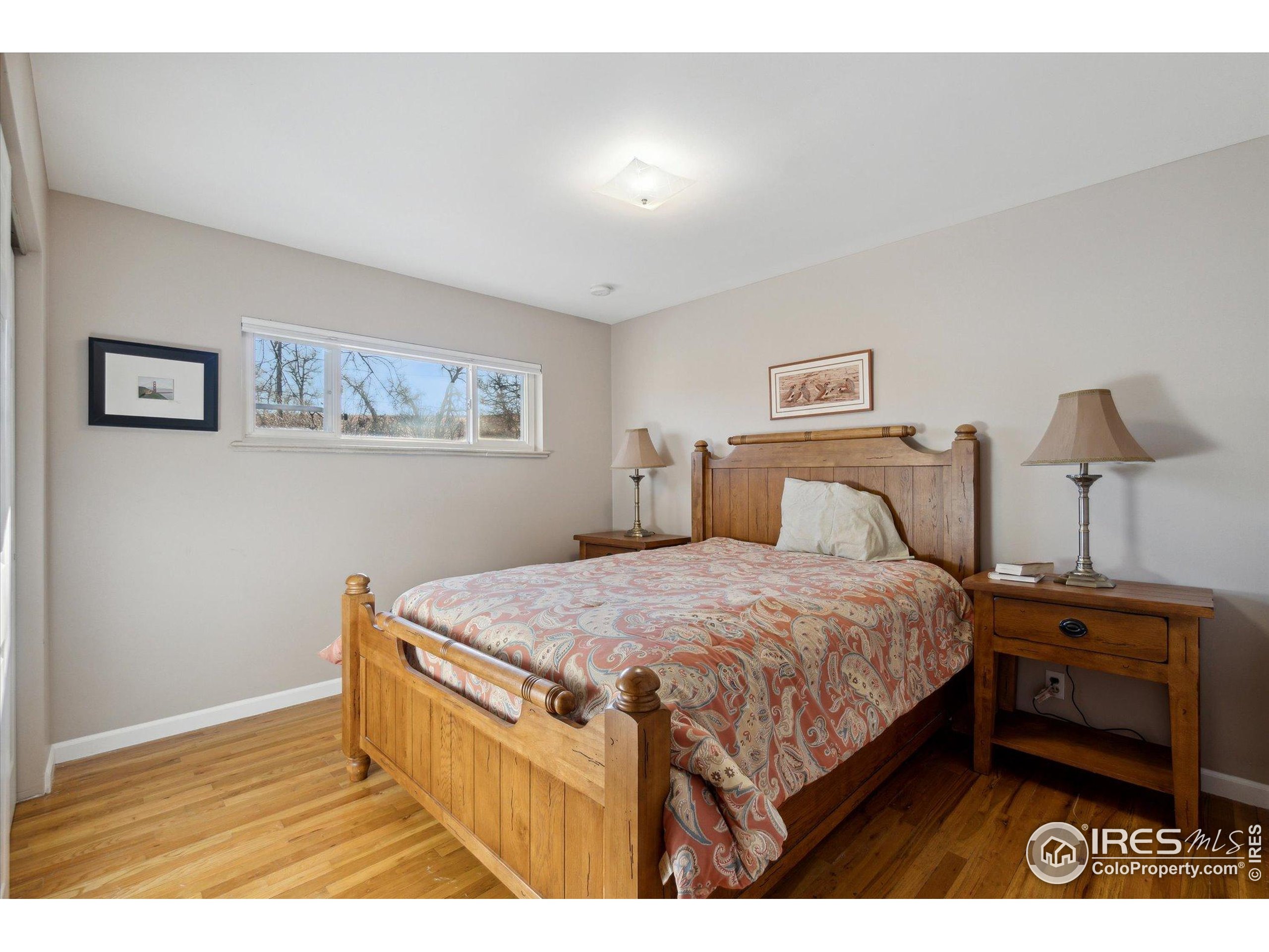 1034 Spring Drive Boulder, CO 80303 - Photo 42 of 49 a bedroom with a bed and a night stand