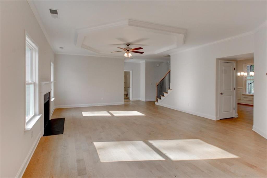 41 Woodland Road Covington, GA 30016 - Photo 29 of 46 wooden floor in an empty room with a window