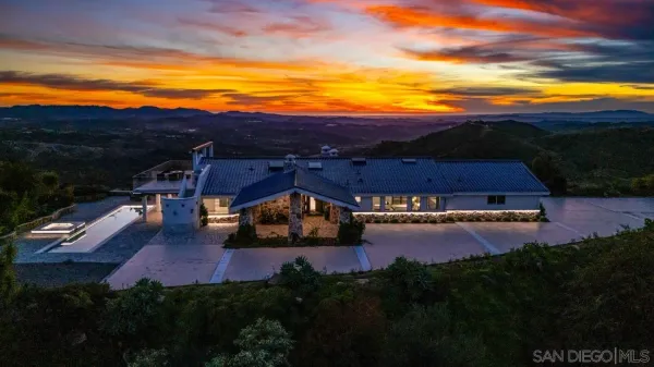 a view of a living room and kitchen with furniture