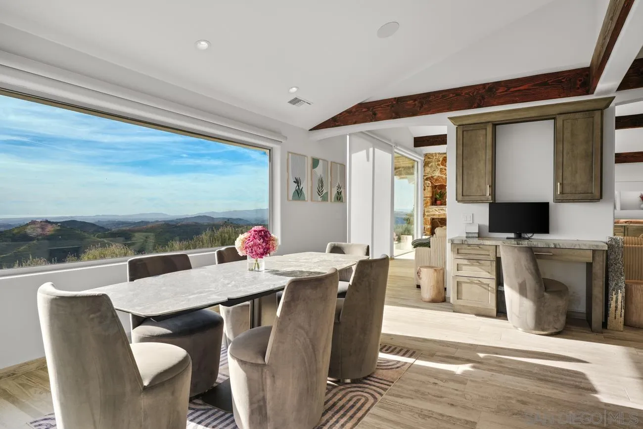 13155 McNally Road Valley Center, CA 92082 - Photo 24 of 69 a view of a dining room with furniture and a kitchen