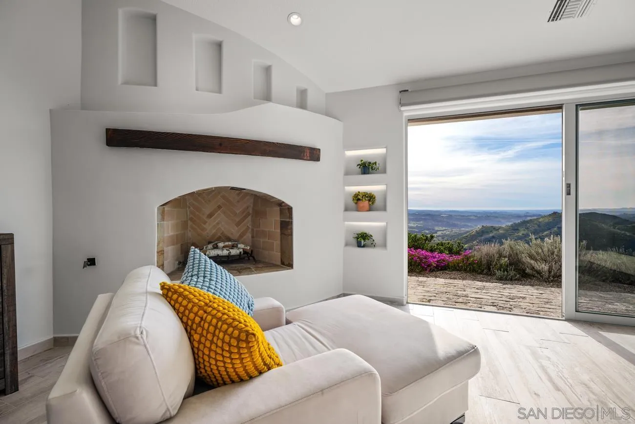 13155 McNally Road Valley Center, CA 92082 - Photo 27 of 69 a living room with furniture and a floor to ceiling window