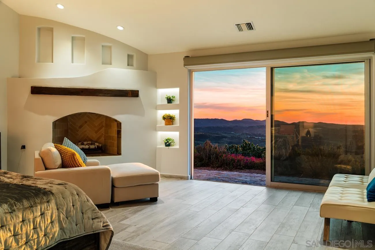 13155 McNally Road Valley Center, CA 92082 - Photo 28 of 69 a bedroom with a bed and a large window
