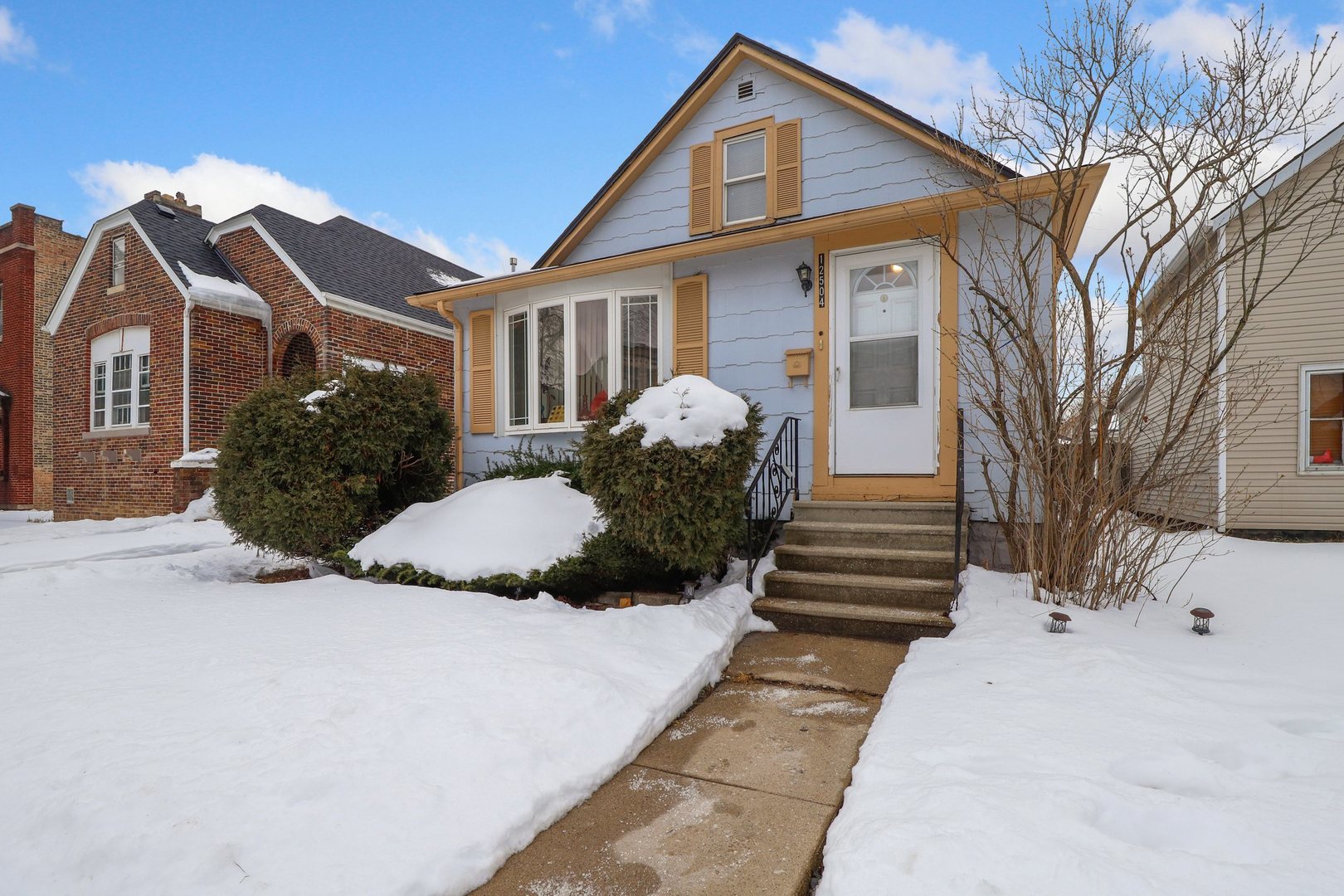 12504 Maple Avenue Blue Island, IL 60406 - Photo 2 of 25 a front view of a house with a yard