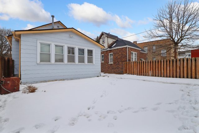12504 Maple Avenue Blue Island, IL 60406 - Photo 24 of 25 a front view of a house with a yard