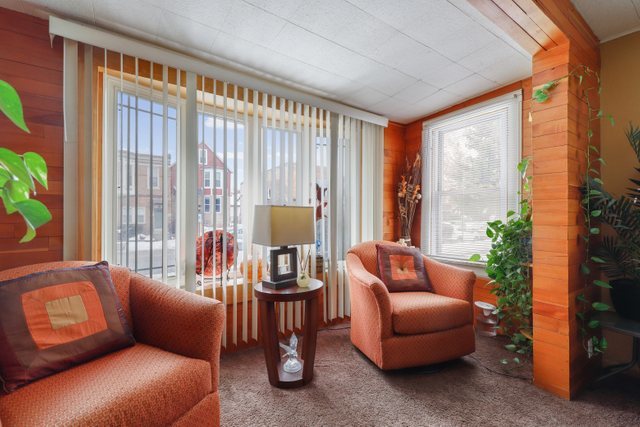 12504 Maple Avenue Blue Island, IL 60406 - Photo 4 of 25 a living room with furniture and a large window