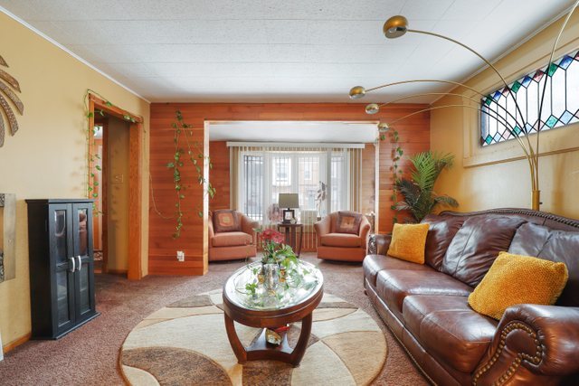 12504 Maple Avenue Blue Island, IL 60406 - Photo 5 of 25 a living room with furniture and a large window