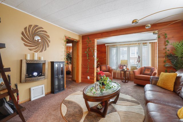 12504 Maple Avenue Blue Island, IL 60406 - Photo 6 of 25 a living room with furniture and a fireplace