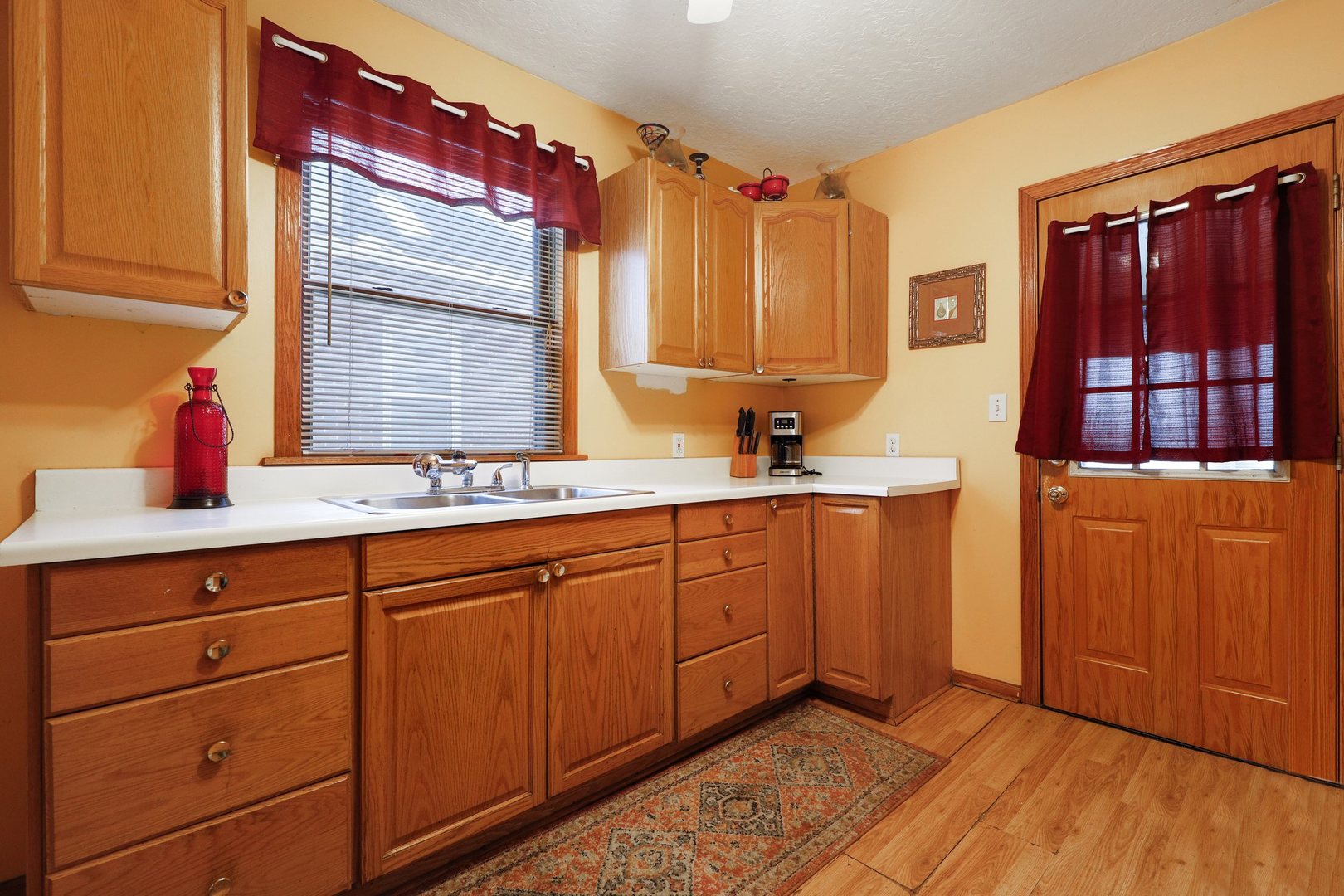 12504 Maple Avenue Blue Island, IL 60406 - Photo 10 of 25 a kitchen with sink and cabinets