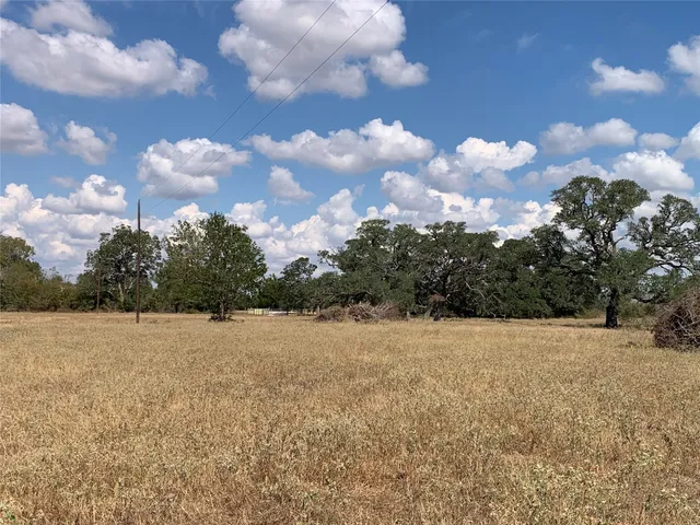 an aerial view of house with a yard