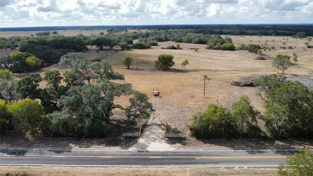 a view of a yard and front of a house