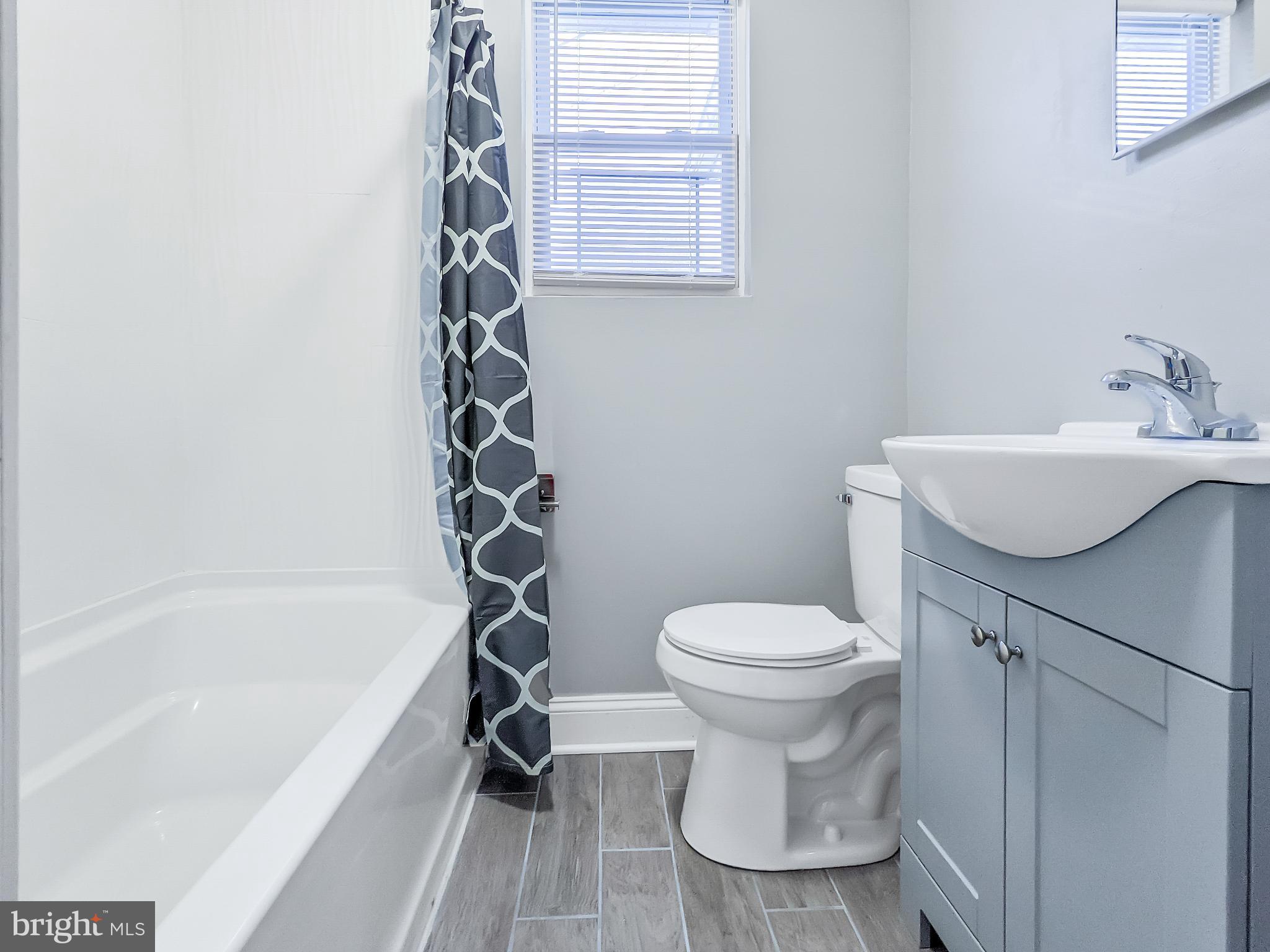 211 Main Street Dundalk, MD 21222 - Photo 11 of 22 Modern bathroom with sleek design elements.