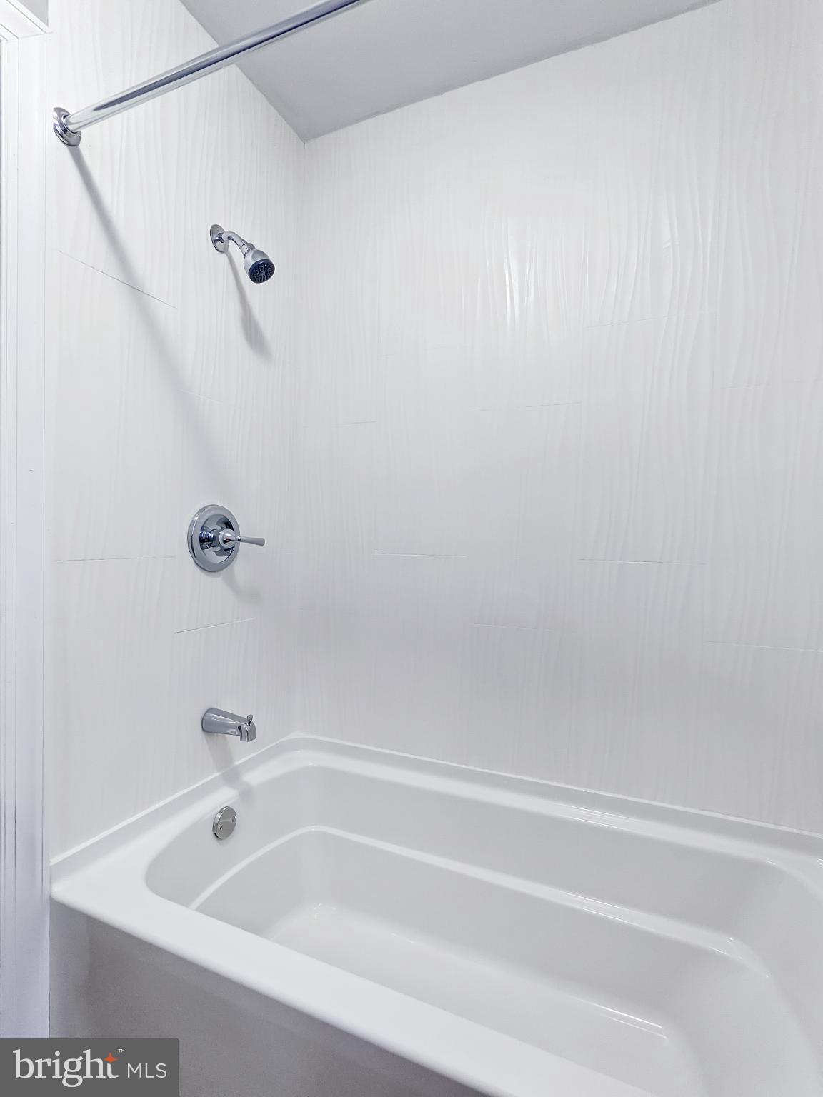 211 Main Street Dundalk, MD 21222 - Photo 13 of 22 Sleek, modern bathroom with clean lines.