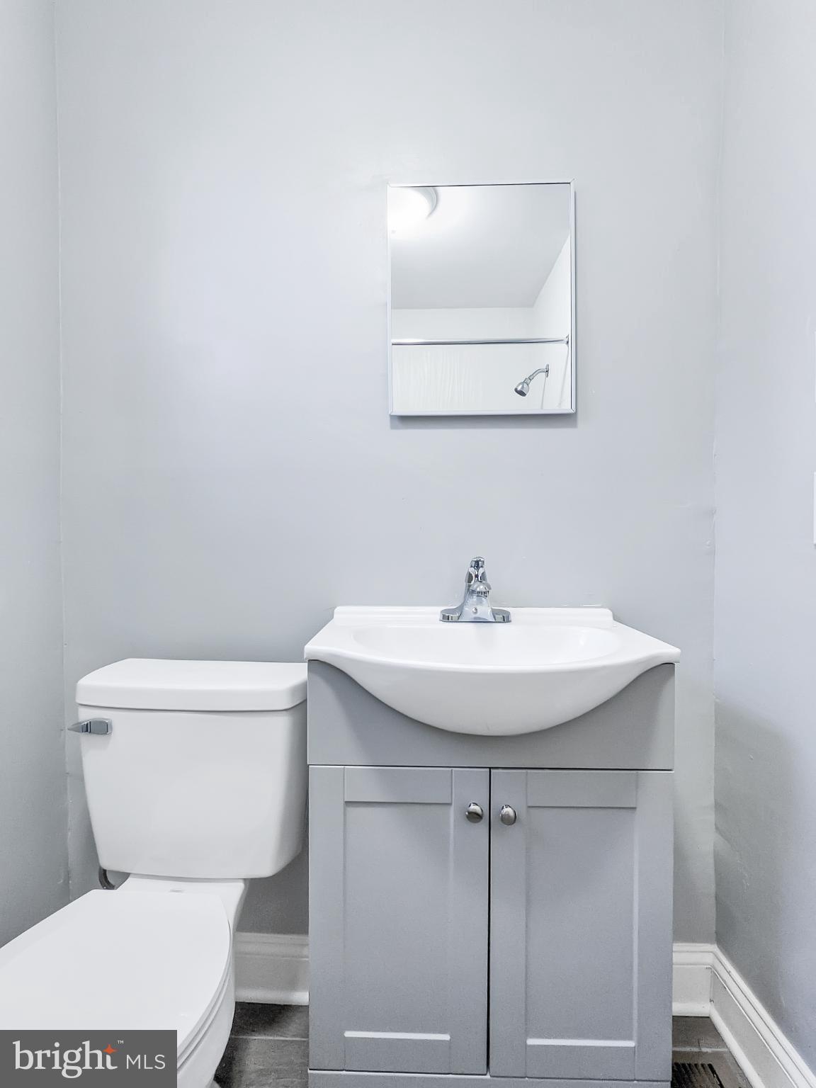 211 Main Street Dundalk, MD 21222 - Photo 15 of 22 Sleek and modern half-bath retreat.