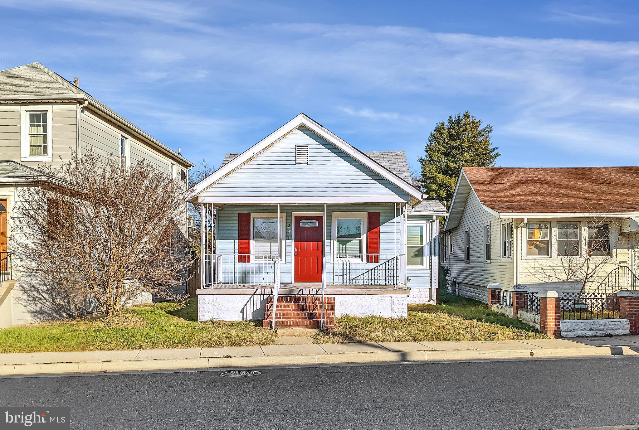 211 Main Street Dundalk, MD 21222 - Photo 2 of 22 Charming bungalow with vibrant red accents.