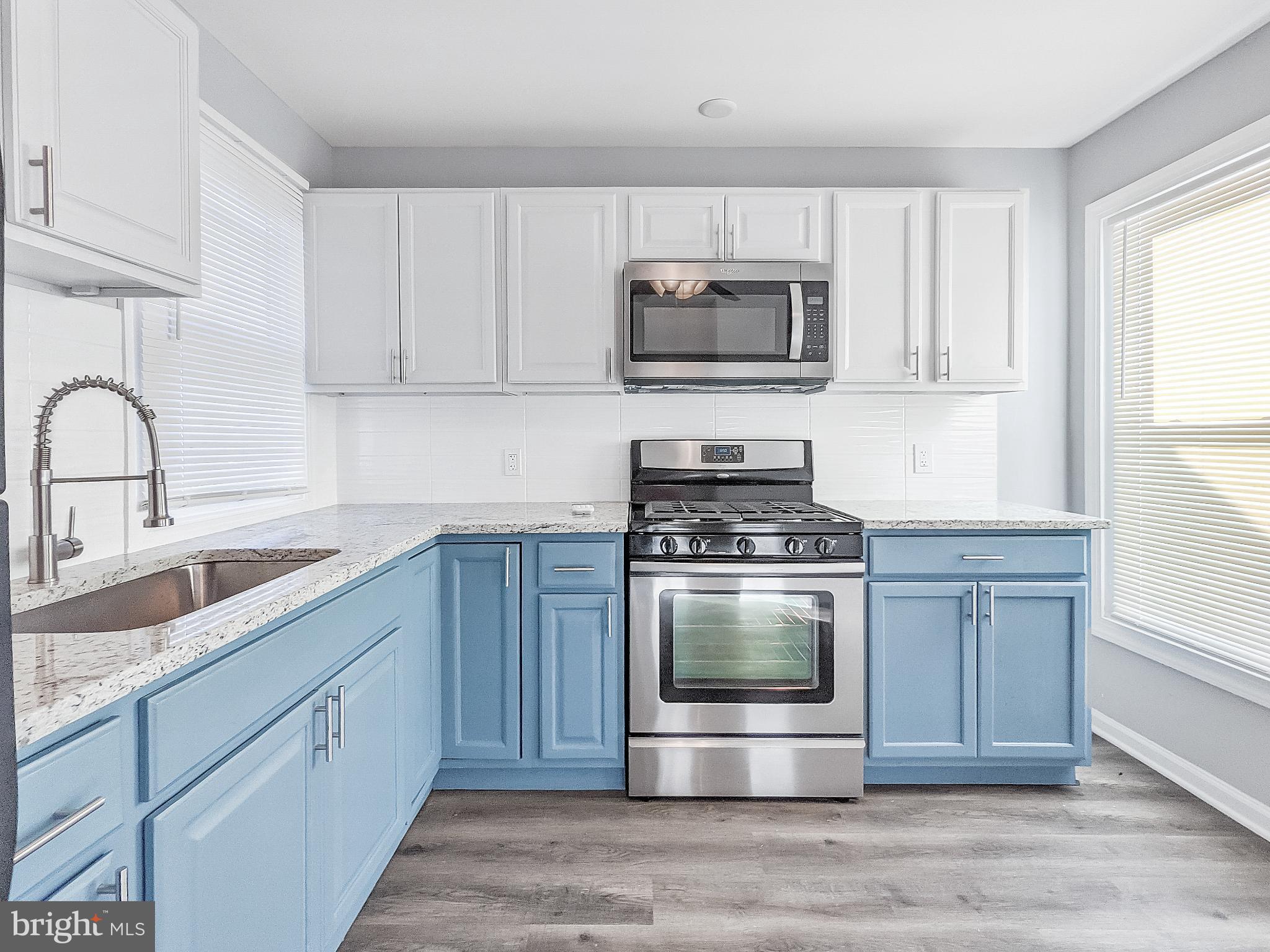 211 Main Street Dundalk, MD 21222 - Photo 6 of 22 Bright and airy modern kitchen design.
