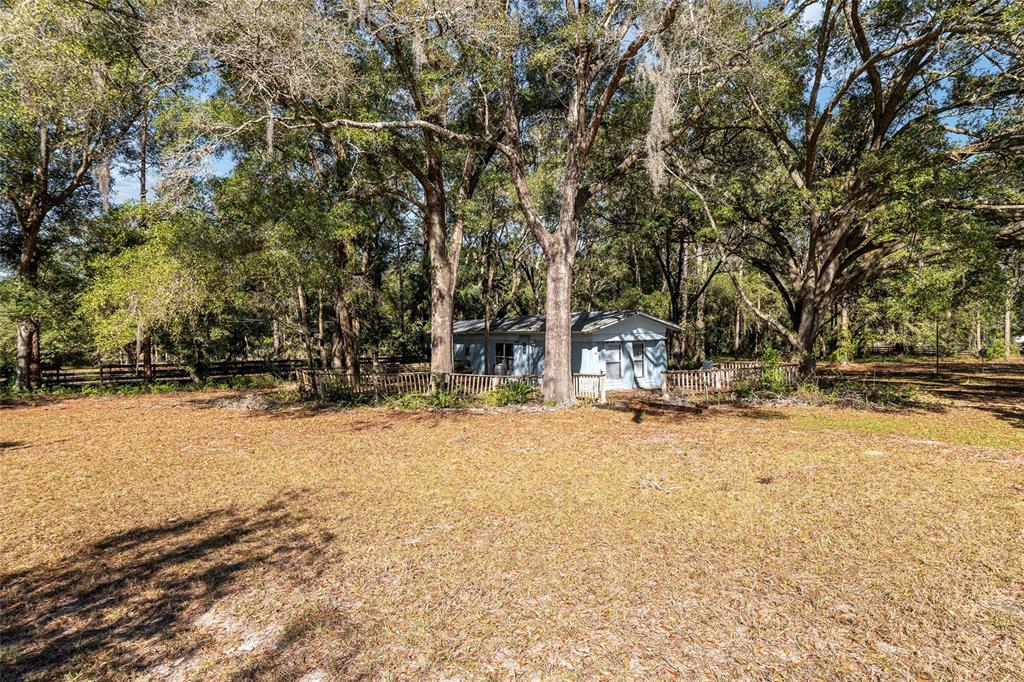 9727 Southwest 138th Street Archer, FL 32618 - Photo 8 of 15 a view of a house with snow on the road
