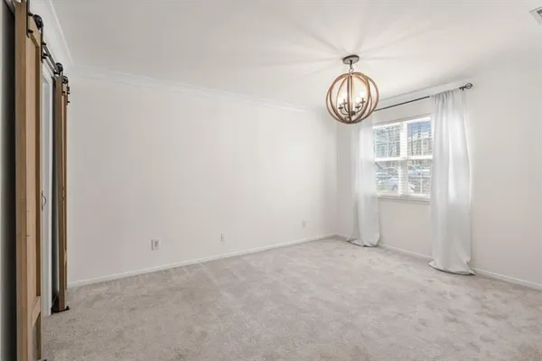 a view of room with wooden floor and window