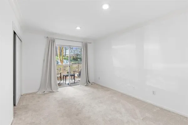 a view of empty room with floor to ceiling window