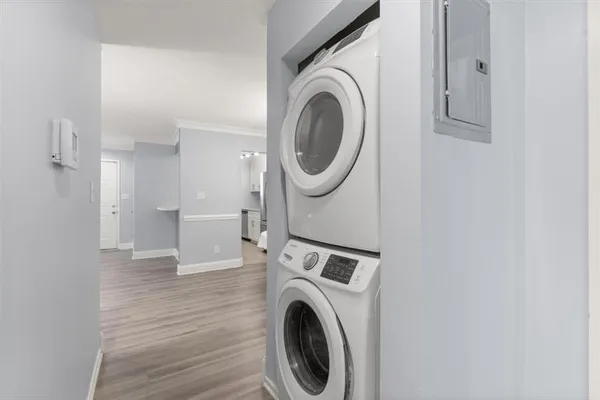 a view of a hallway with washer and dryer