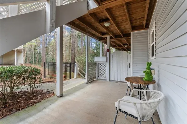a view of a chairs and table in the patio