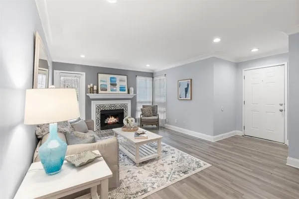 a living room with furniture and a fireplace