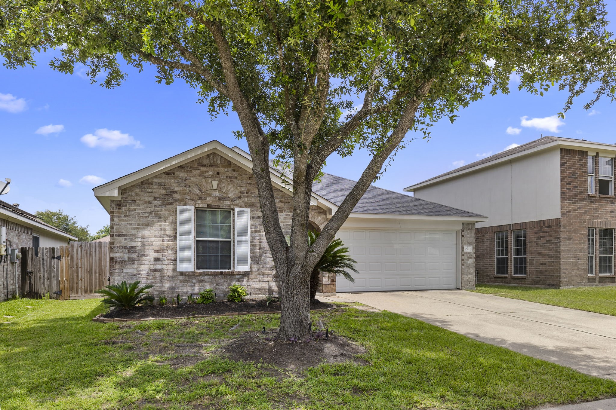 29106 Foxingham Circle Spring, TX 77386 - Photo 3 of 47 a front view of a house with a yard and garage