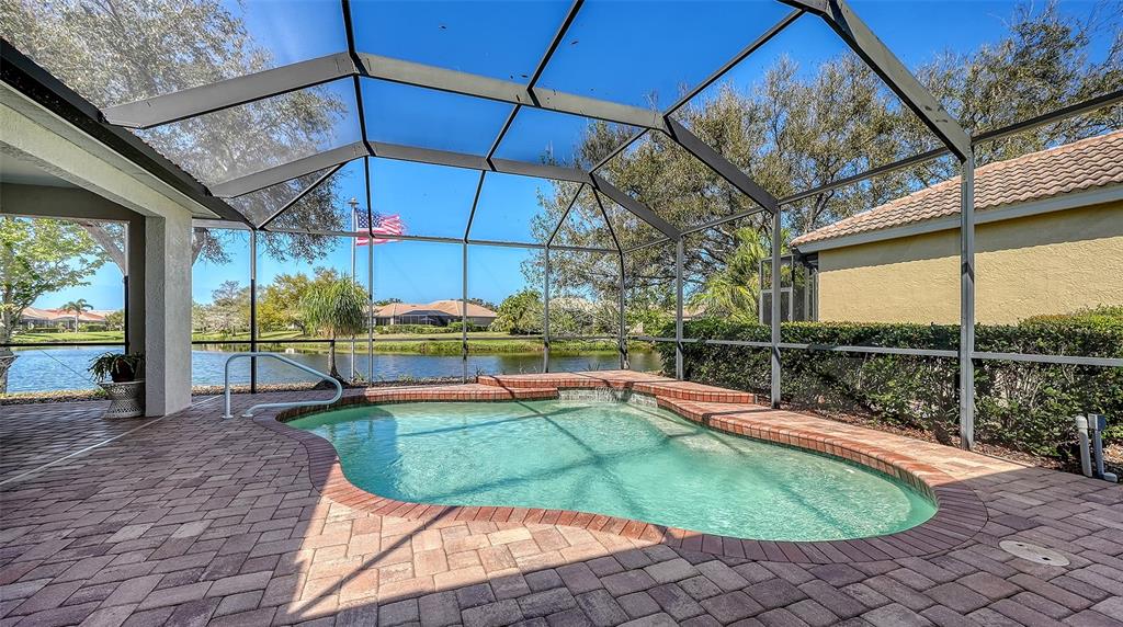 665 Crane Prairie Way Osprey, FL 34229 - Photo 2 of 61 a view of a swimming pool with a patio