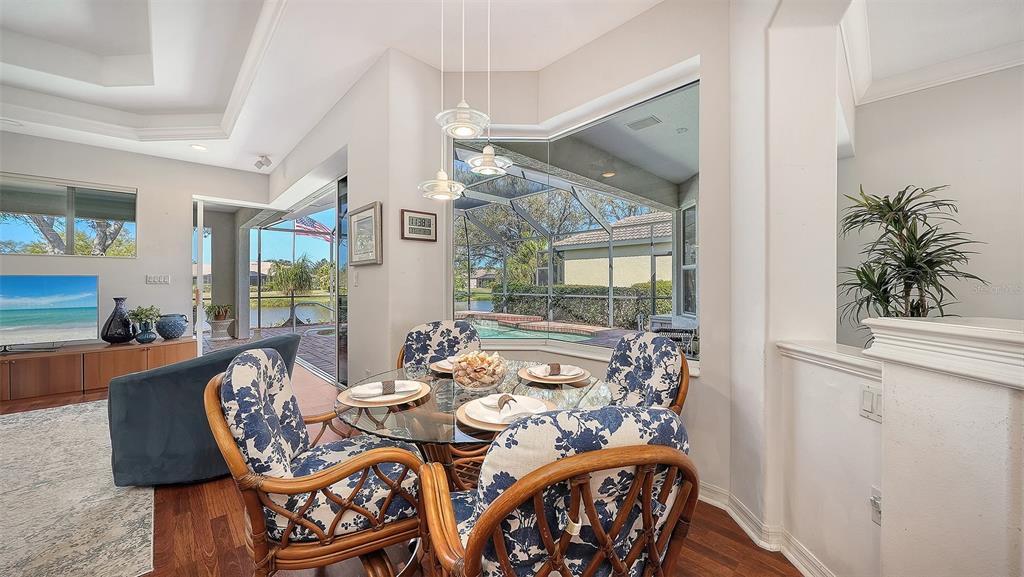 665 Crane Prairie Way Osprey, FL 34229 - Photo 21 of 61 a view of a dining room with furniture window and outside view