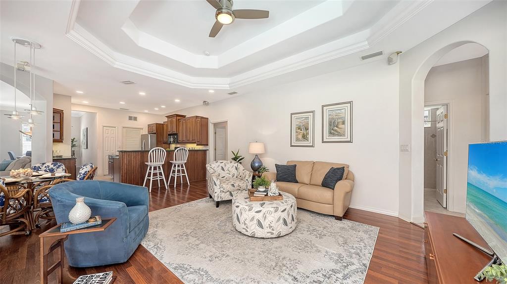665 Crane Prairie Way Osprey, FL 34229 - Photo 23 of 61 a living room with furniture and a dining table