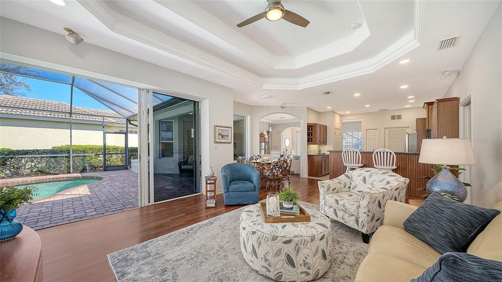 665 Crane Prairie Way Osprey, FL 34229 - Photo 25 of 61 a living room with furniture and a large window