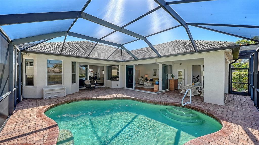 665 Crane Prairie Way Osprey, FL 34229 - Photo 26 of 61 a view of a porch with chairs and backyard