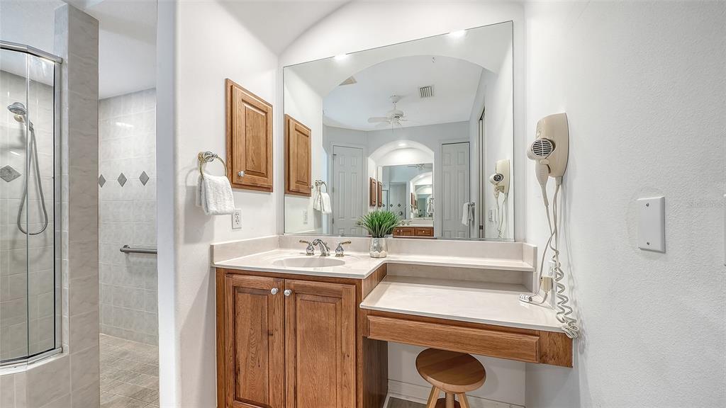 665 Crane Prairie Way Osprey, FL 34229 - Photo 34 of 61 a view of bathroom with a sink mirror and vanity