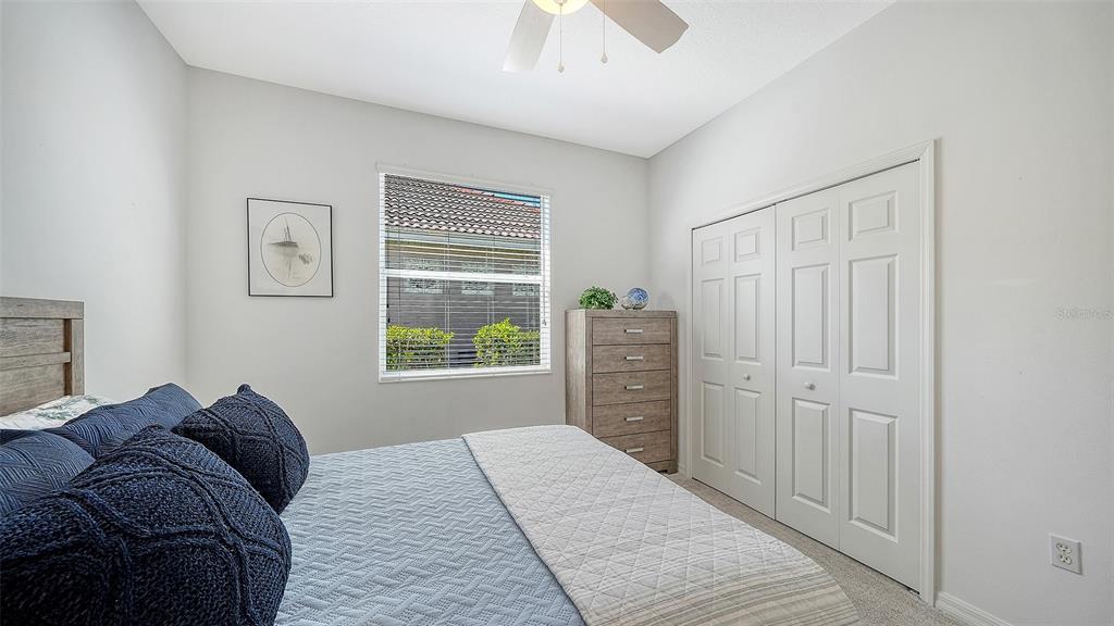 665 Crane Prairie Way Osprey, FL 34229 - Photo 37 of 61 a bed room with a bed and a window