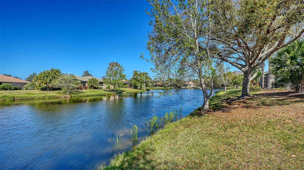 665 Crane Prairie Way Osprey, FL 34229 - Photo 49 of 61 a view of a lake with houses