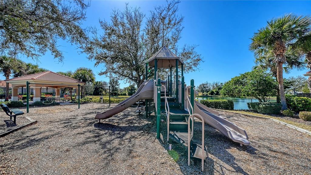 665 Crane Prairie Way Osprey, FL 34229 - Photo 59 of 61 a view of a house with backyard and sitting area