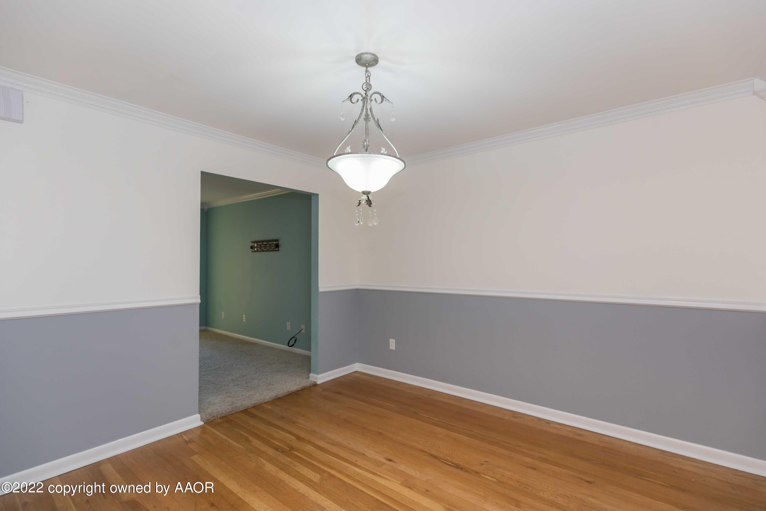 1302 Potter Street Borger, TX 79007 - Photo 12 of 53 wooden floor in an empty room