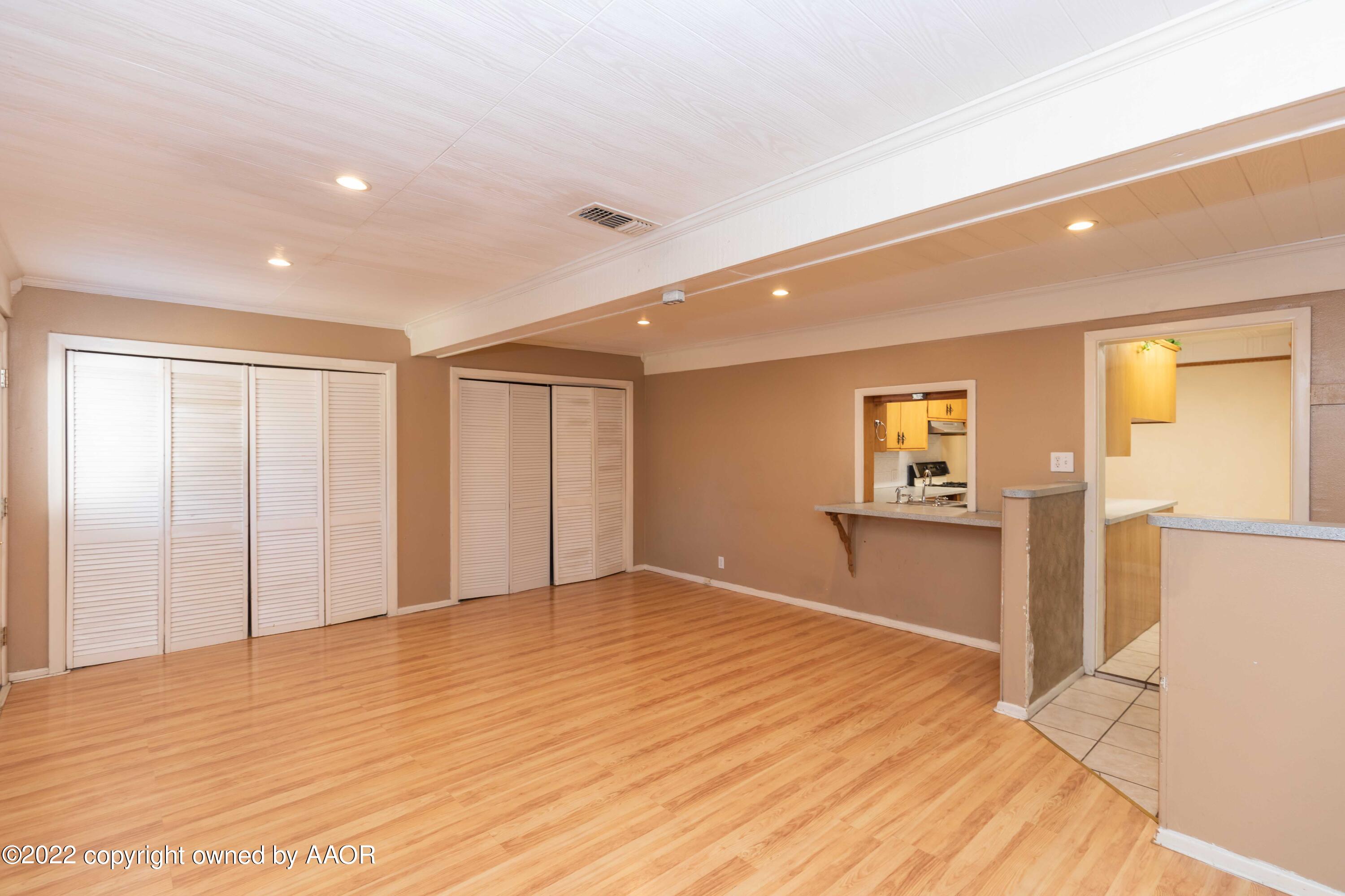 1302 Potter Street Borger, TX 79007 - Photo 14 of 53 a view of empty room with wooden floor