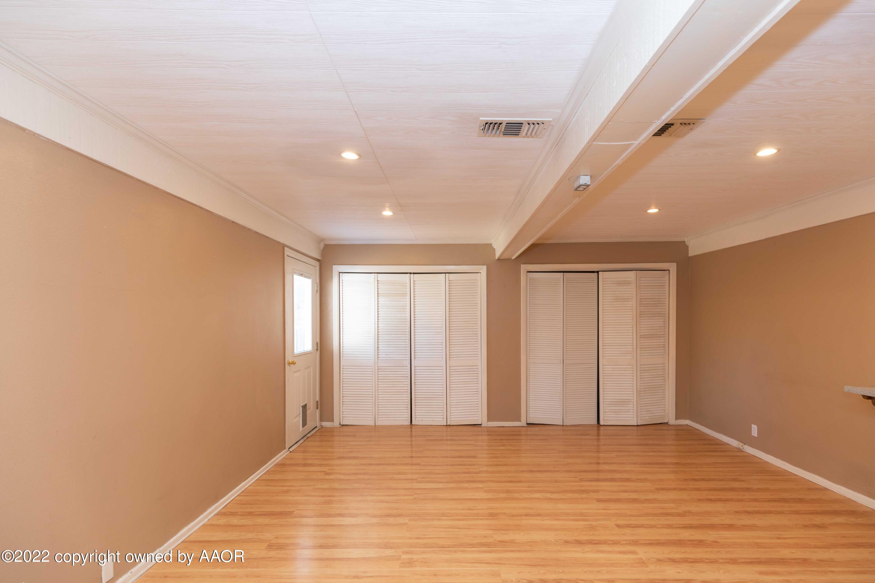 1302 Potter Street Borger, TX 79007 - Photo 15 of 53 a view of an empty room with wooden floor