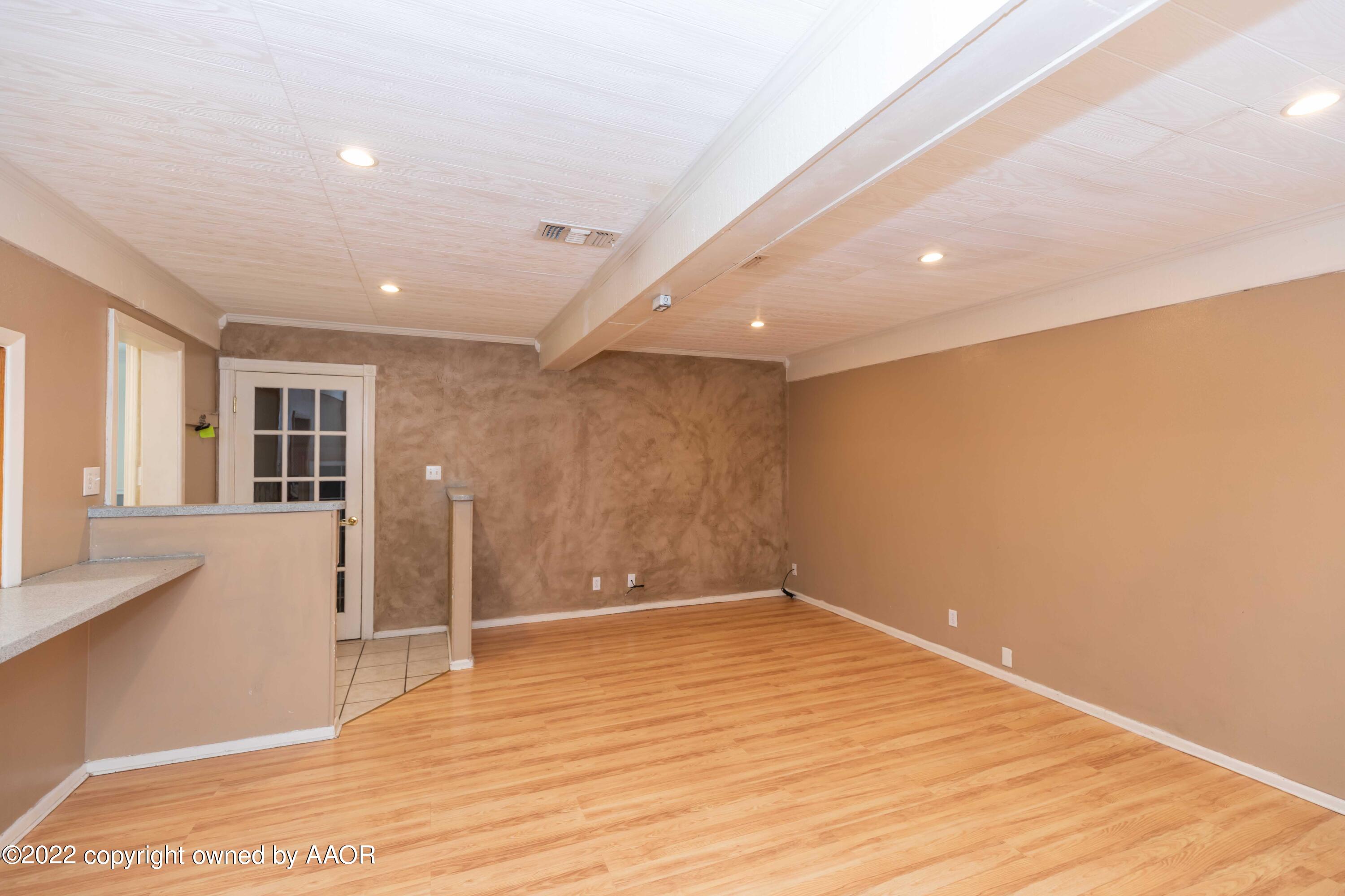 1302 Potter Street Borger, TX 79007 - Photo 16 of 53 a view of empty room with wooden floor